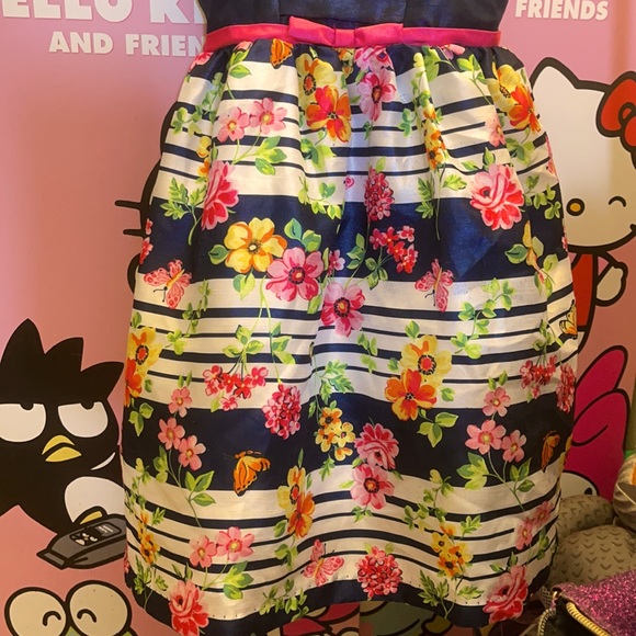 Blue dress with flower pattern on the skirt. - Picture 3 of 8